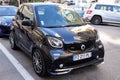 Smart brabus car small black little parked in street Royalty Free Stock Photo