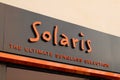 Solaris boutique brand logo and sign text on facade entrance fashion front store