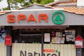 Spar sign logo and brand text red green entrance facade store supermarket