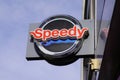 Speedy logo text and brand sign on car repair store station garage