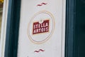 Stella Artois beer advertising of Belgian sign logo and brand text on wall pub Royalty Free Stock Photo