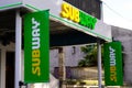 Subway logo text and brand sign restaurant facade American fast food restaurant shop