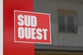 Sud ouest newspaper shop sign text and brand logo on windows french library store