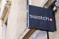 Swatch logo brand and text sign on facade store swiss chain watch manufacturing