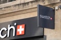 Swatch logo chain and text sign front of store swiss watches brand shop