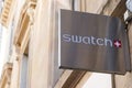 Swatch logo and sign text front of store fashion brand watches shop in street view