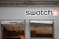Swatch logo and text sign front facade wall of store swiss watches brand shop chain