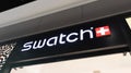 Swatch logo and text sign front of store swiss watches brand shop