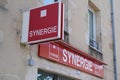 Synergie sign text and brand logo on wall facade Temporary work agency company office Royalty Free Stock Photo