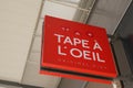 Tape a l`oeil logo brand and text sign storefront signage front of fashion clothing