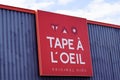 Tape a l`oeil logo red and text sign of French fashion clothing brand for children