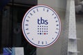 TBS store logo and text sign front of windows store clothing sport boat and shoes