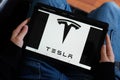 Bordeaux , Aquitaine / France - 11 30 2019 : Tesla car logo on tablet screen electric vehicle Motors Inc sign