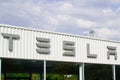 Tesla car text sign and logo store front of showroom dealership electric vehicle shop