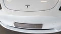 Tesla car y model 3 inside dealership logo sign and brand text front ev