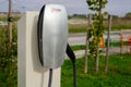 Bordeaux , Aquitaine / France - 10 27 2019 : tesla charger EV Electric car at charging station with power cable supply plugged