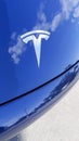 Tesla logo and t sign front of car brand in showroom dealership electric vehicle shop