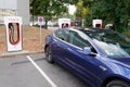 Tesla Supercharger car stations fast-charged for ev with model 3 american electric Royalty Free Stock Photo