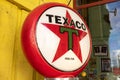 Texaco gas station sign text and logo brand from Chevron Corporation on pump station