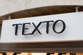 Texto logo brand and text sign on wall facade store fashion city street Royalty Free Stock Photo