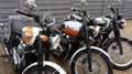 Three triumph bonneville t100 neo retro old school vintage motorbike outdoor