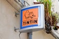 Tintin logo sign store of comic hero shop sell book comics toys brand text