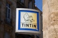 Tintin logo text and brand sign store facade of comic hero shop of herge book comics