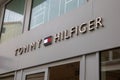 tommy Hilfiger sign brand and text logo store front wall facade of American clothing Royalty Free Stock Photo