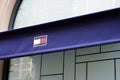 Tommy Hilfiger sign flag and brand logo store front of American fashion boutique Royalty Free Stock Photo