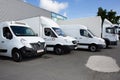 transport dumont several white cars vans trucks parked in parking lot for rental and Royalty Free Stock Photo