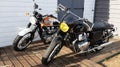 Triumph bonneville and royal enfield motorcycles neo retro classic bike parked for sale