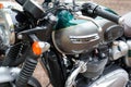 Triumph bonneville t120 bonnie grey green bike detail side view logo brand and text