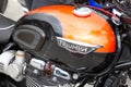 Triumph bonneville t100 detail sign text and brand logo on motorbike neoretro fuel Royalty Free Stock Photo