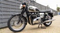 Triumph bonneville t100 green grey motorcycle classic retro british motorbike in silver Royalty Free Stock Photo
