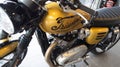 Triumph bonneville t120 motorcycle detail sign text and logo on golden fuel tank on