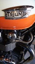 Triumph bonneville t100 sign text and brand logo on motorbike neo-retro tank orange Royalty Free Stock Photo