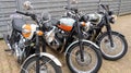 Triumph bonneville t100 three models of retro vintage bonnie motorbike parked