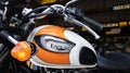 Triumph bonneville t100 vintage logo sign and text on orange white motorcycle fuel Royalty Free Stock Photo
