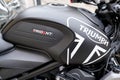 Triumph trident roadster sport motorcycle detail sign text and brand logo on black