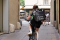 Uber eats delivery man on bike ride on city commercial street in Bordeaux town France Royalty Free Stock Photo