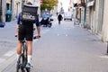 Ubereats delivery man on bike cycle to delivery restaurant