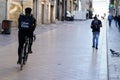 Ubereats delivery man on bike ride on commercial street in Bordeaux France