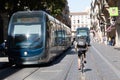 Bordeaux , Aquitaine / France - 11 07 2019 : Ubereats delivery man on bike ride on tram road Bordeaux Tramway