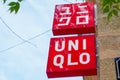 Uniqlo logo brand and text red sign store clothes shop front of Japanese fashion Royalty Free Stock Photo