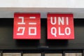 Uniqlo logo and text red sign store clothing shop front of Japanese brand Royalty Free Stock Photo