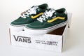 Vans logo brand and text sign closed checkered shoe box with green shoes clothes Royalty Free Stock Photo