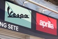 Vespa and aprilia italy dealership sign text and brand logo of italian motorcycle and