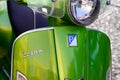 Vespa Italian brand text and logo sign front of scooter green modern manufactured by