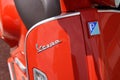 Vespa Italian brand text and logo sign front of scooter red modern manufactured by