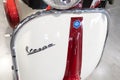 Vespa text sign and brand text on front of old timer vintage scooter motorcycle from